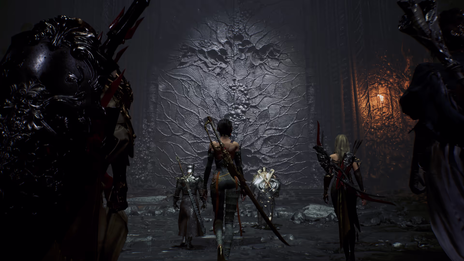 Four member party entering a dark dungeon gate with weapons drawn